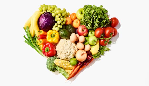 fresh fruits and vegetables making a heart