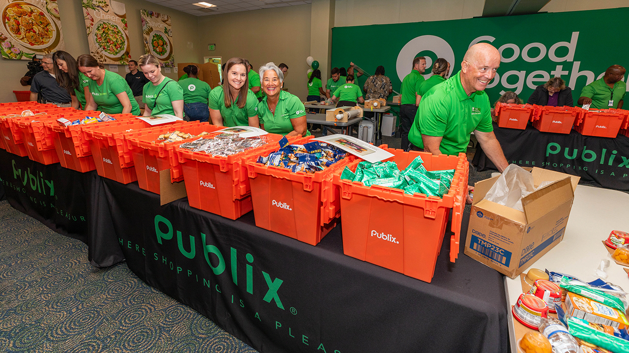 Publix associates filling boxes at a food bank