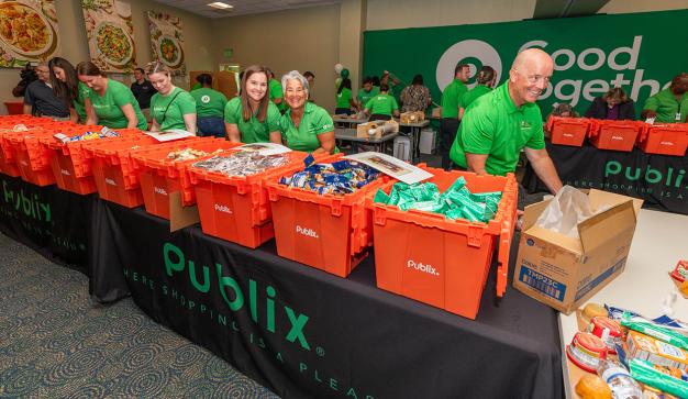 Publix associates filling boxes at a food bank