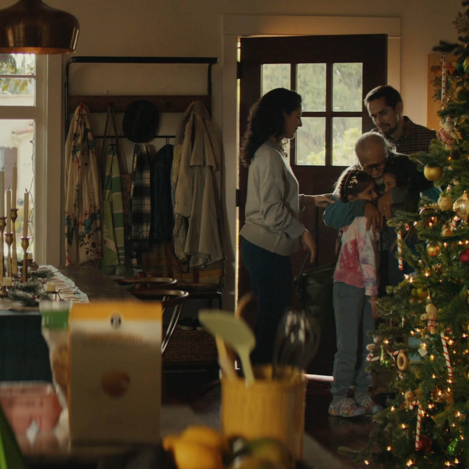 Family hugging at Christmas