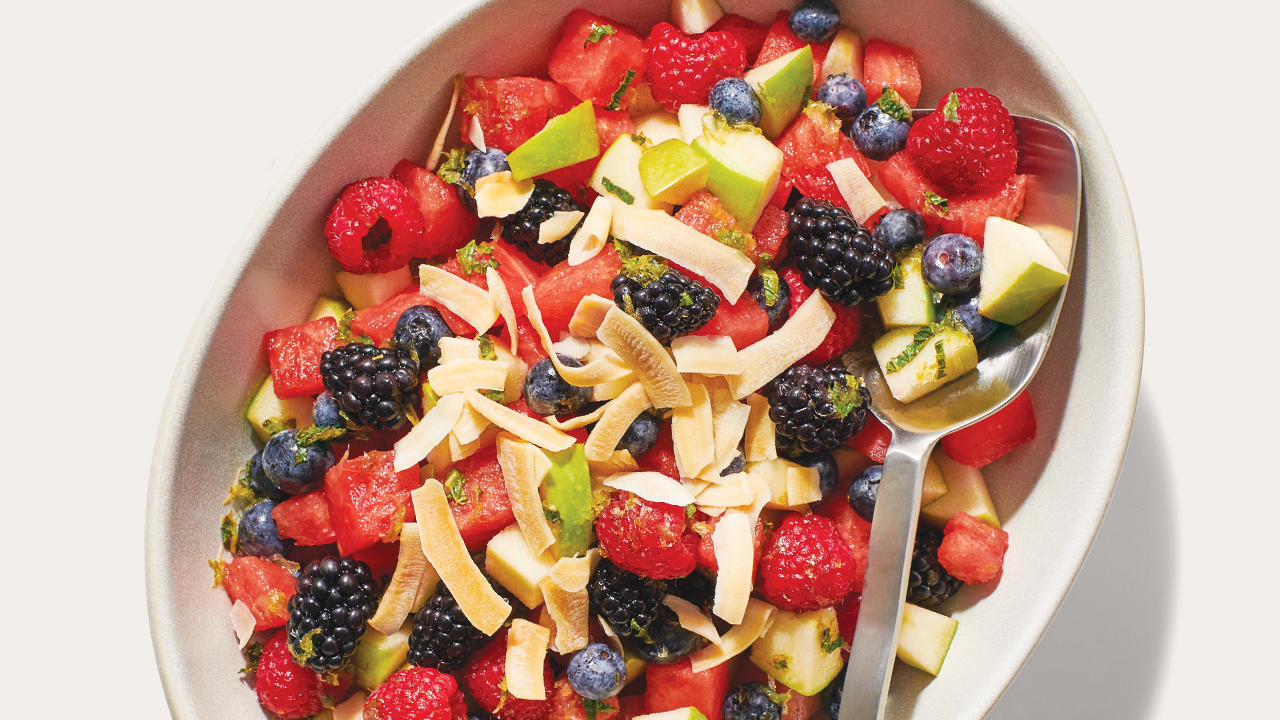 a bowl of colorful fruit salad
