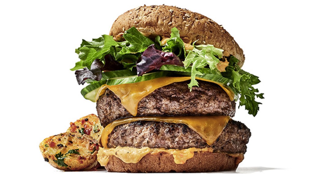 two thick and juicy patties topped with crisp lettuce and a fluffy multigrain bun